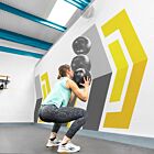 Female athlete exercising with wall ball