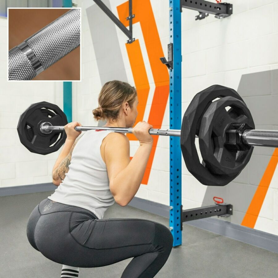 Female athlete performing barbell back squat