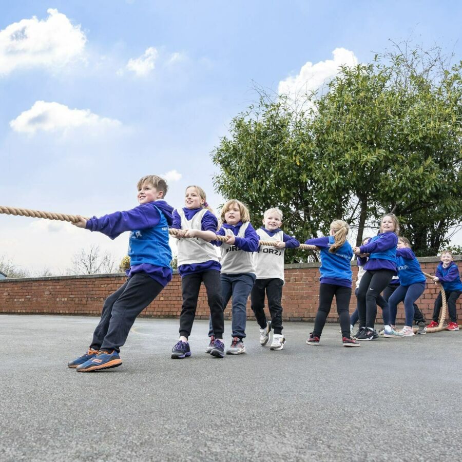 Children competing in tug of war competition