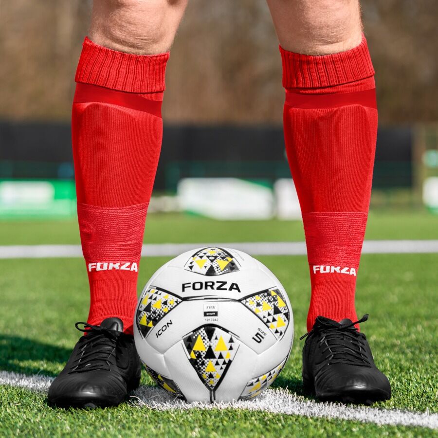 shin pads and red socks
