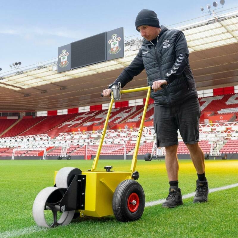 Groundskeeper marking out soccer field lines Groundskeeper marking out soccer field lines